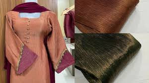 Traditional Punjabi suit displayed with matching fabric swatches, highlighting the right fabric for Punjabi suit in silk blend.